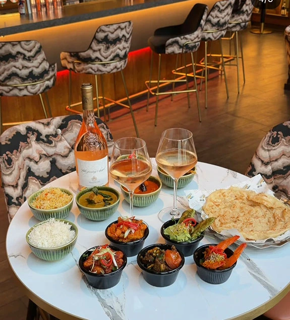 Bottomless brunch spread at UYARE with rosé wine and mezze bowls