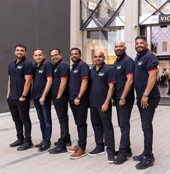 Tharavadu team celebrating the launch of Uyare rooftop South Indian restaurant in Leeds