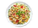 Rice dish garnished with herbs and vegetables on a plate
