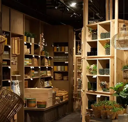 New Leeds retail space interior with wooden shelving and plants, 2025 opening
