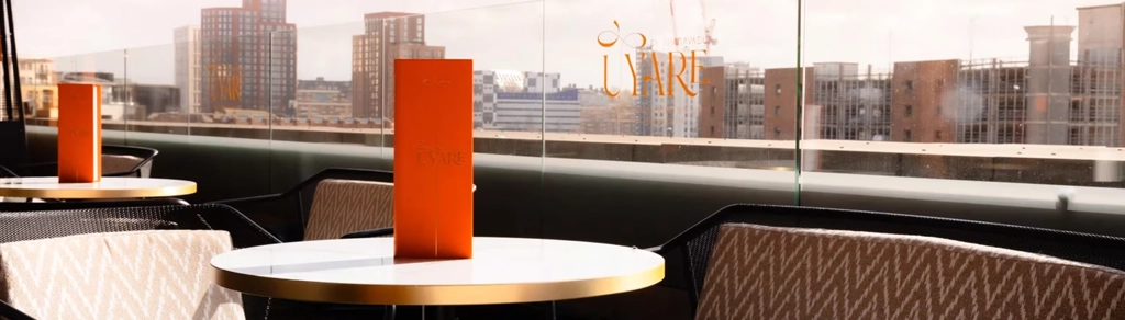 UYARE rooftop terrace tables with city skyline view in Leeds