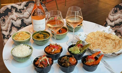 Bottomless brunch spread with rosé wine and mezze bowls at UYARE