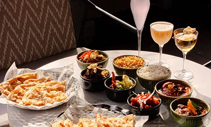 Sunday feast spread with cocktails, mezze bowls, and flatbread at UYARE