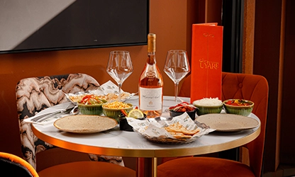 Wine and mezze dinner table set for pre-theatre dining at UYARE Leeds