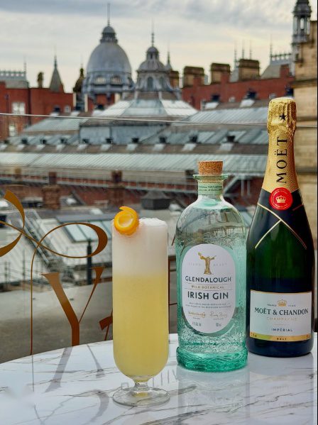 Champagne glasses overlooking Leeds skyline from Uyare rooftop